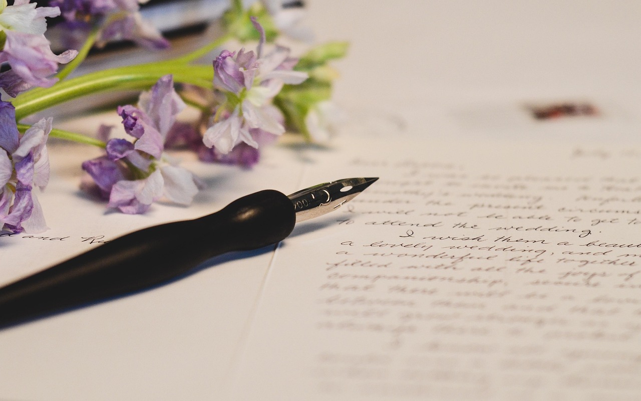 Calligraphy pen on a handwritten letter